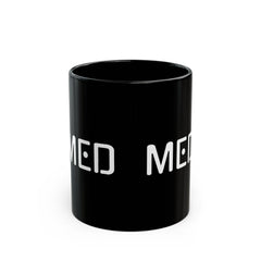 Black mug with 'MED' printed on a white background