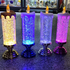 Four colorful LED candle lights on a reflective surface with a blurred background.