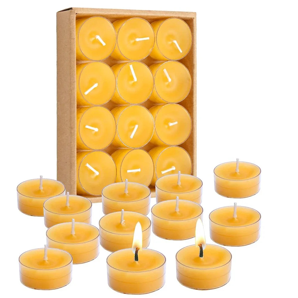 Set of yellow candles with a cardboard box packaging on a white background