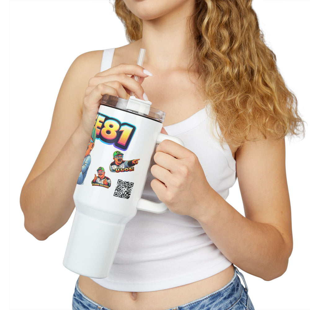 Person holding a white tumbler with colorful graphics and text
