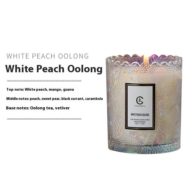 White Peach Oolong candle with decorative label on a white background