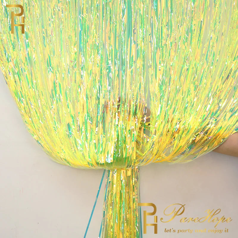 Yellow and green tinsel curtain with brand logo on a white background