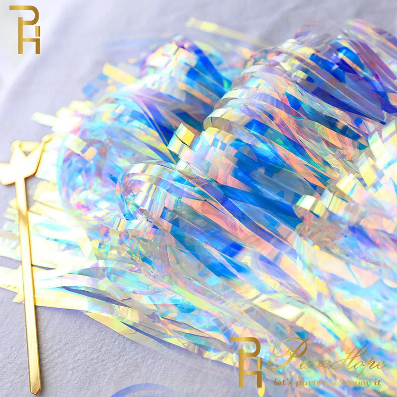 Holographic tinsel with a gold tool on a light gray background