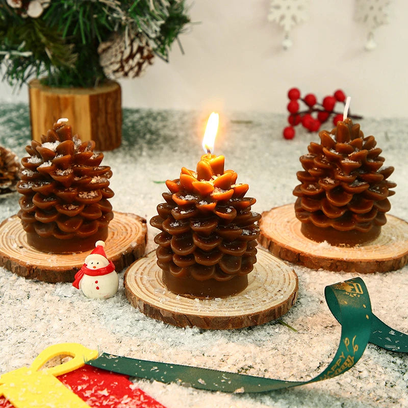 Pine cone-shaped candles on wooden bases with a festive background