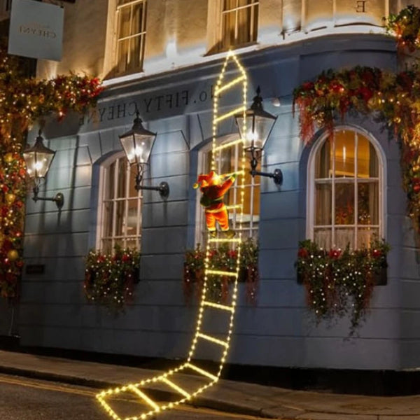 Decorated building facade with festive lights and ornaments on a street corner.