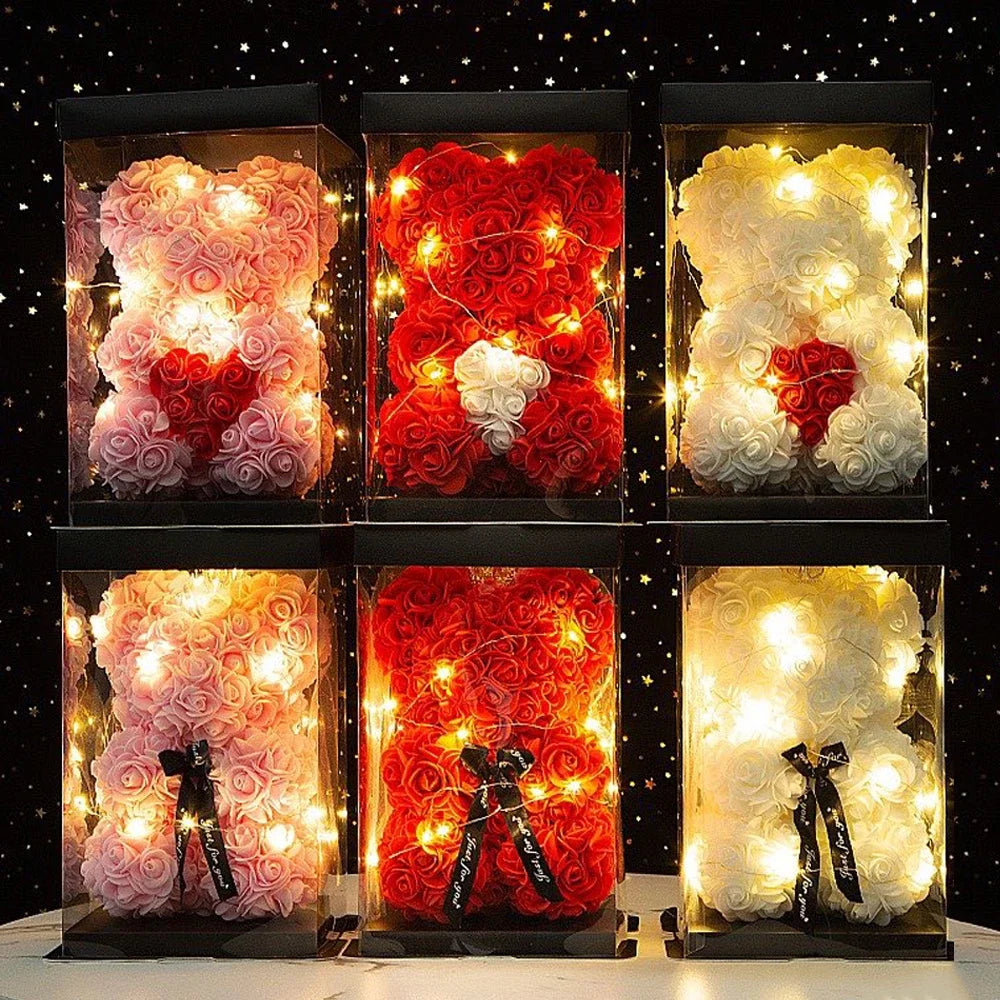 Six decorative bears made of flowers with lights on a dark background