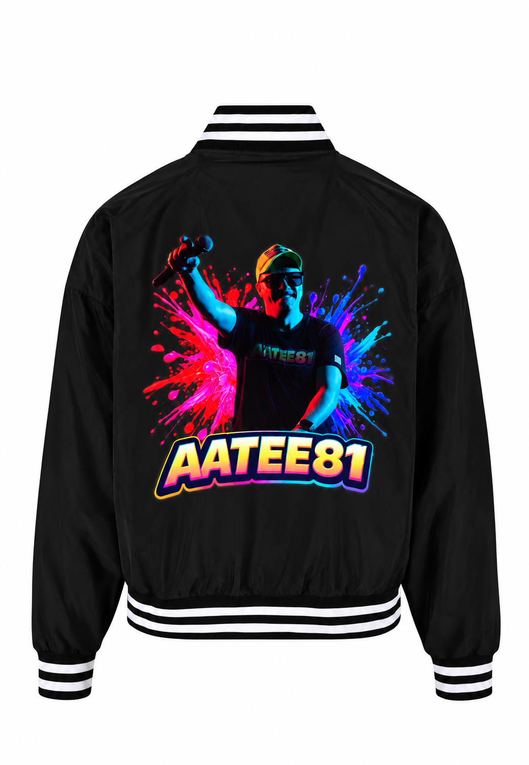 A black varsity-style bomber jacket shown from the back, featuring a large colorful graphic of a person with a paint splatter background and the text 'AATEE81' in bold outlined lettering. The jacket has white and black striped ribbed collar, cuffs, and hem.