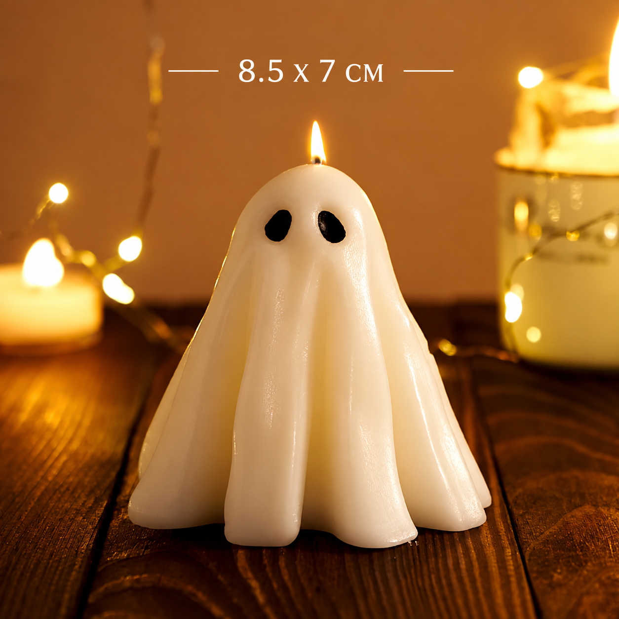 A ghost-shaped white candle with black eyes sits on a dark wooden surface, surrounded by warm string lights and other blurred candles. White text at the top reads '8.