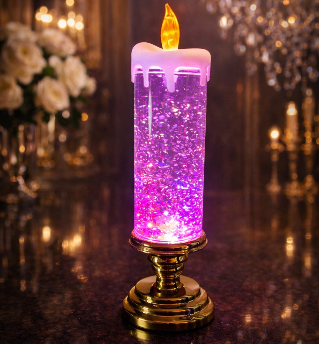 Decorative candle with purple and pink light on a reflective surface with blurred flowers and lights in the background