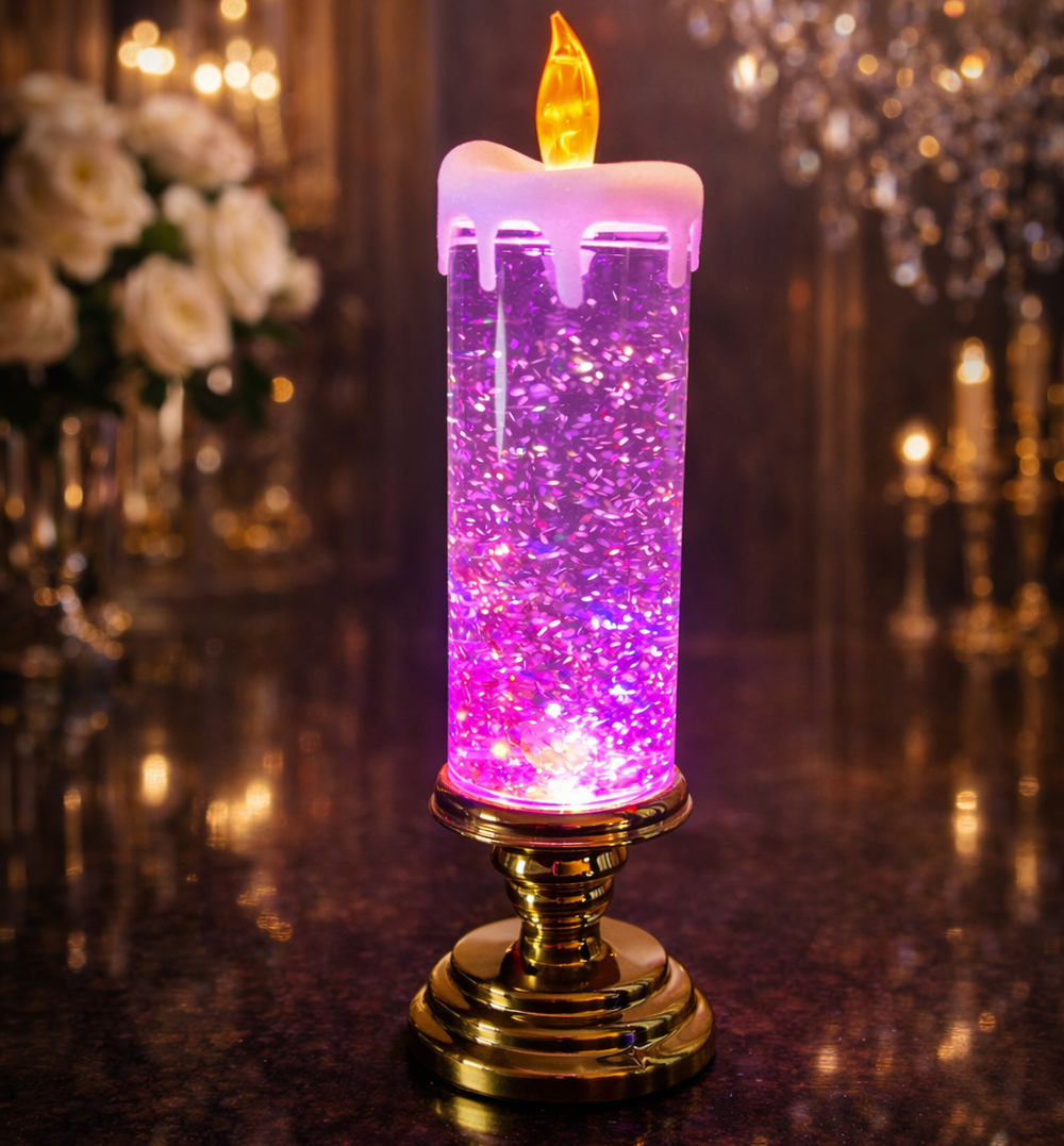 Decorative candle with purple and pink light on a reflective surface with blurred flowers and lights in the background