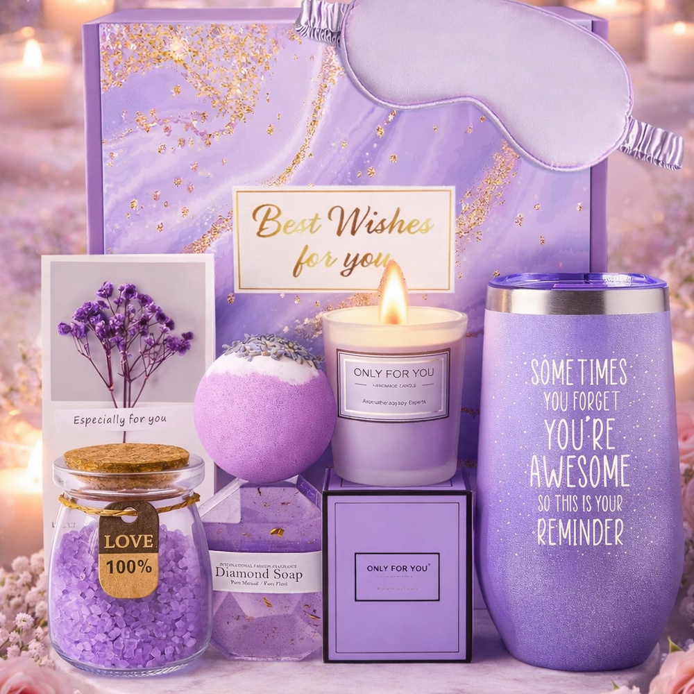 Gifting set with candles, tumbler, and bath products on a decorative background