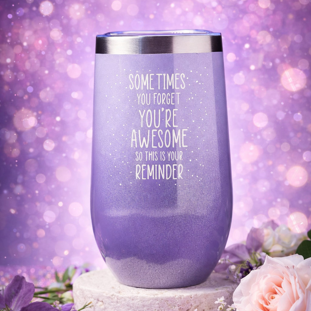Purple tumbler with motivational quote on a purple background with flowers